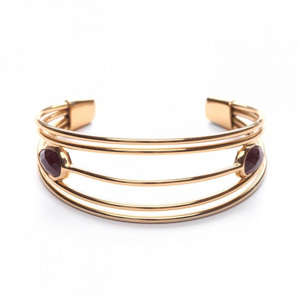Golden bangle with cut stones