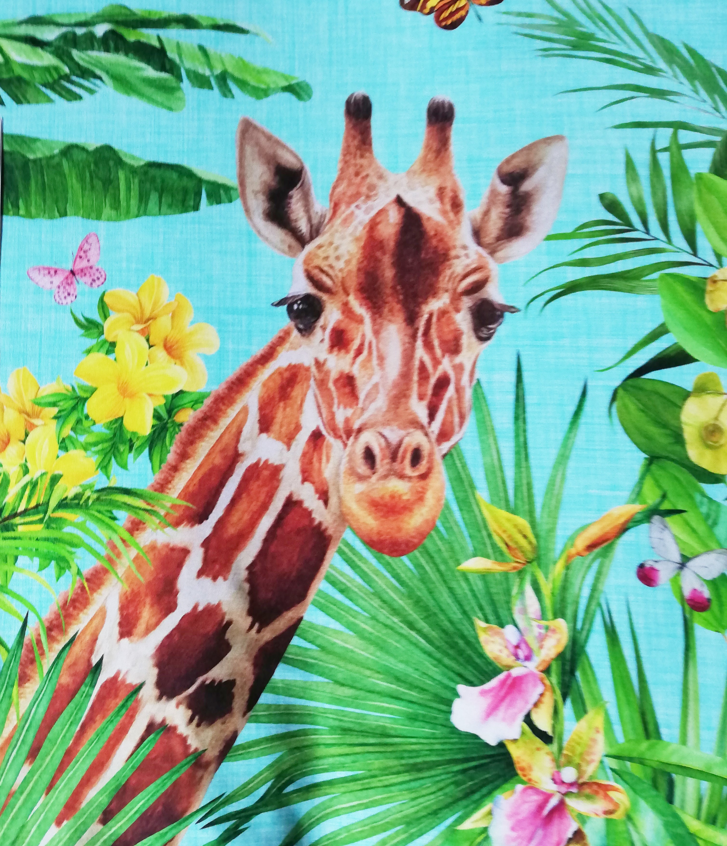 Stenzo giraffe panel under palm trees on turquoise linen look background 