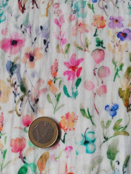 Fine cotton muslin in nature with lots of little colorful flowers